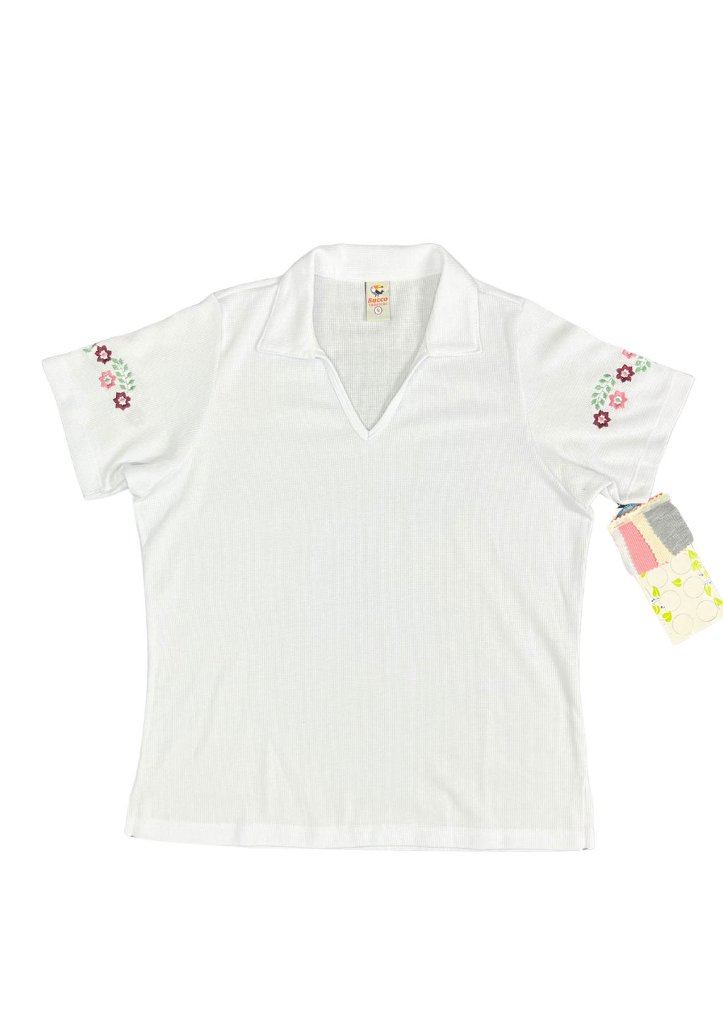 23744B blusón silueta amplia, bordado floral.